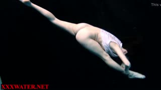 Blonde amateur explores shadowy pool depths