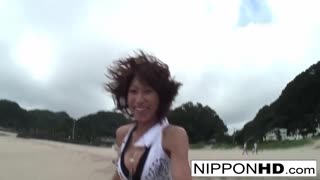 Asian Hottie Sucks Her Man Dry on a Sunny Beach