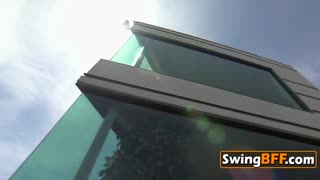 swingers group enjoys sensual fun kissing and softcore action in the sun