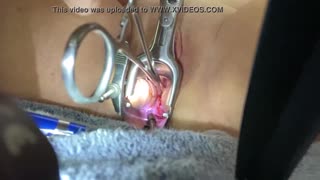 Masochist slave spreads shaved pussy for extreme medical sounding and speculum insertion