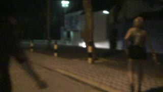 two naughty girls showing off on the streets and sucking on the beach