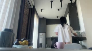 Hey, sexy fit brunette doing housework without any panties on