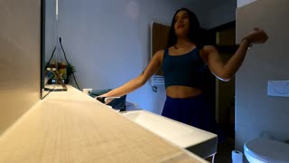 This cutie rocks a sexy blue mini skirt showing off her panties