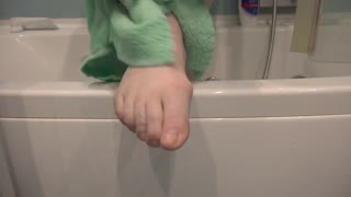 close-up views of mature woman's nylon-clad legs and feet in amateur solo