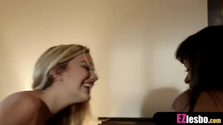 Ebony and blonde teen explore each other with wet tongues