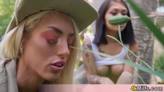 A busty MILF gardener in uniform bares her pussy outdoors for a POV threesome you can't refuse