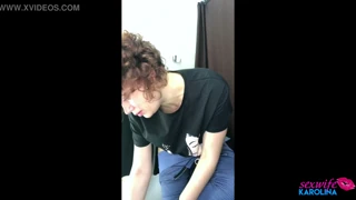 this milf tries on clothes in the fitting room while being watched