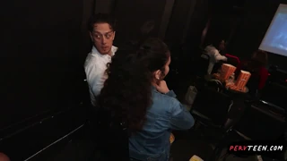 A Latina gets groped by a stranger in the theater as it's turning playful during the movie