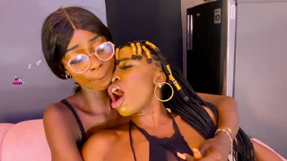 lesbian women enjoy riding a sex machine together