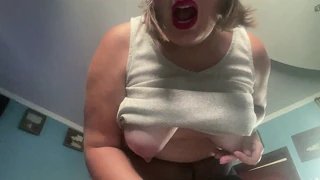 A mature woman in pantyhose reaches release through her own touch during a solo moment
