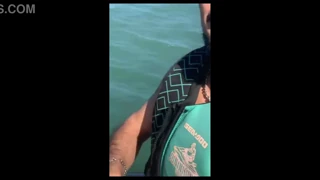 What activity occurs between a young woman and an instructor on a jet ski (EroZyx)?
