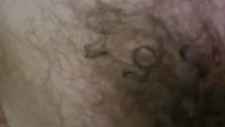 hairy guy reaches his peak while the scene unfolds in full view