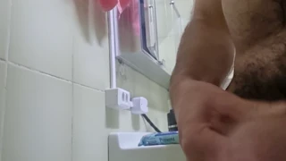 hairy guy reaches his peak while the scene unfolds in full view