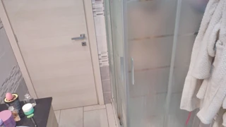 a blonde takes her shower