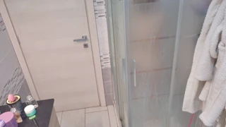 a blonde takes her shower