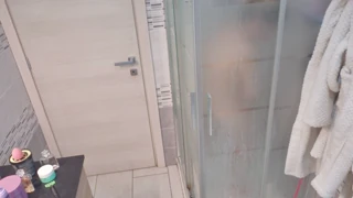 a blonde takes her shower