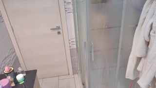 a blonde takes her shower