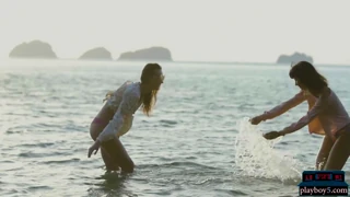 How do the girlfriends enjoy the ocean on EroZyx?