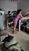 A woman masturbates in the kitchen with her huge tits and touches herself