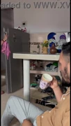 A woman masturbates in the kitchen with her huge tits and touches herself