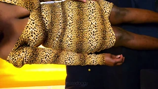 Assvee wears a cheetah print dress that hides her big booty