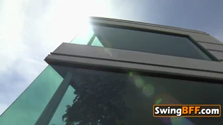 swingers group enjoys sensual fun kissing and softcore action in the sun